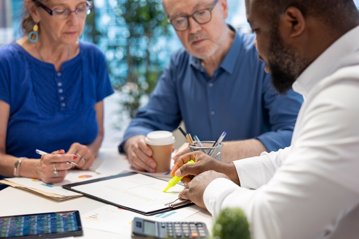 Insurance broker highlighting the important contract terms